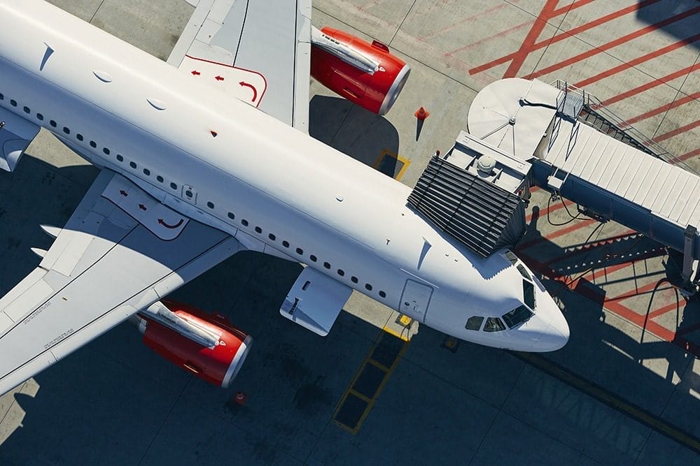 Aerial view of an airplane parked at an airport.