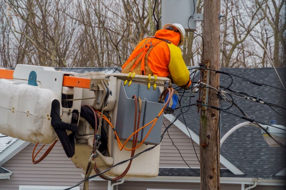 service electrical lines men handling damage after storm
