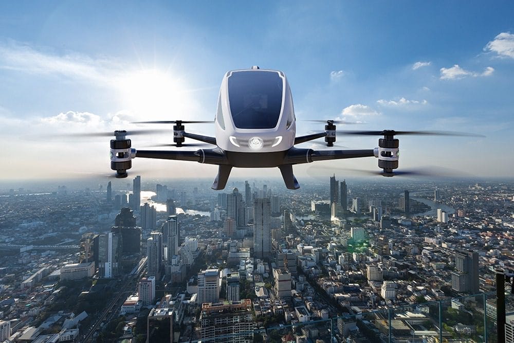 Autonomous driverless aerial vehicle flying on city background