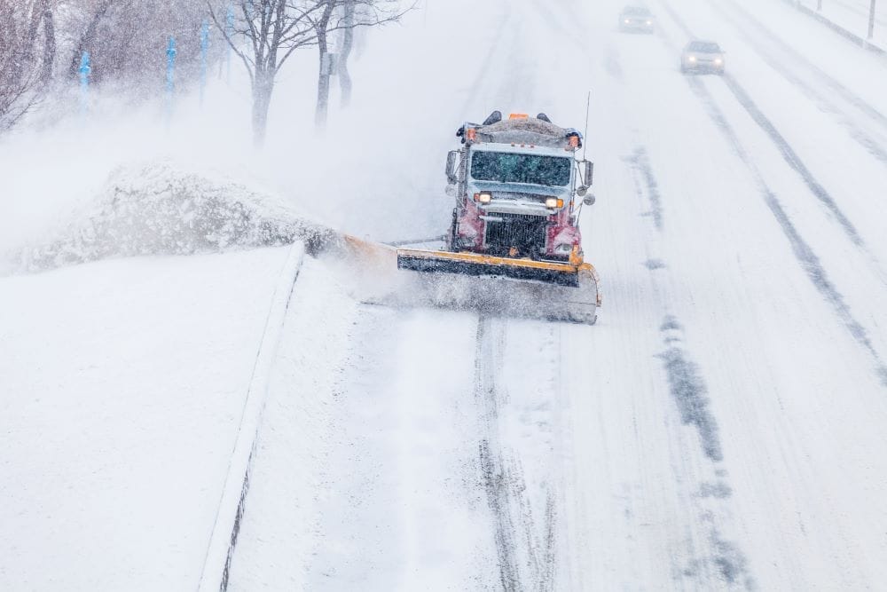 snowplow removing the snow from the highway during 2021